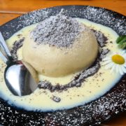 Germknoedel Sweet Austrian Dumpling Filled With Jam Served With Vanilla Sauce, Poppy Seeds And Butter