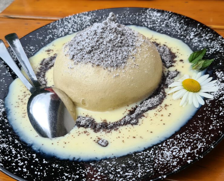 Germknoedel Sweet Austrian Dumpling Filled With Jam Served With Vanilla Sauce, Poppy Seeds And Butter