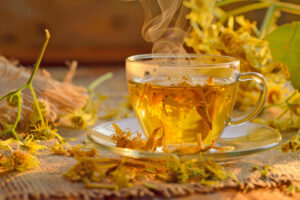 A Soothing Cup Of Linden Flower Tea, With Dried Linden Flowers S