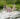 The Girl Swims Against The Background Of Bathing Other Family Members.